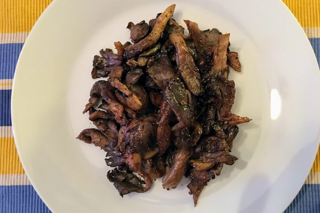 Mushrooms on a white plate with a sauce from the Apicius cookbook